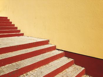 Stairs with yellow wall