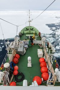 High angle view of boat moored in frozen sea