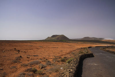 Scenic view of desert against clear sky