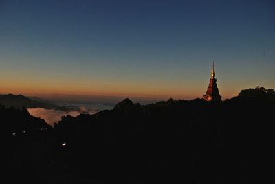 Built structures against sky at dusk