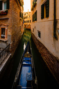 Front end of gondola as it crosses canal in venice