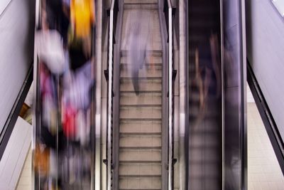 High angle view of people on escalator at subway station