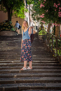 Rear view of women walking on staircase