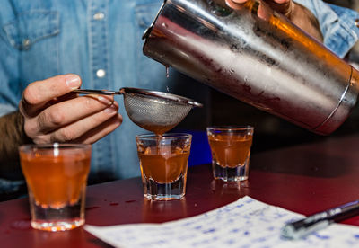 Close-up of wine glasses on table