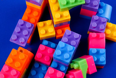 Close-up of toy blocks on blue background