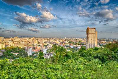 Buildings against cloudy sky