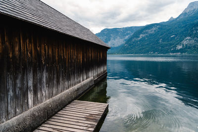 Scenic view of lake by mountain against sky