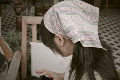 Rear view of woman wearing hat