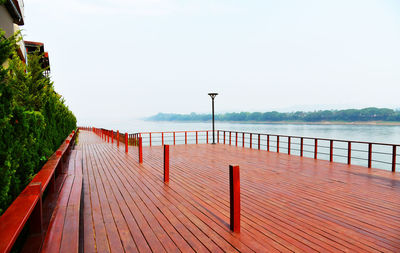 Pier over sea against clear sky