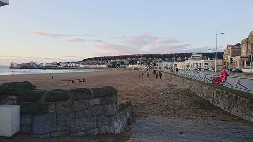 View of beach against cloudy sky