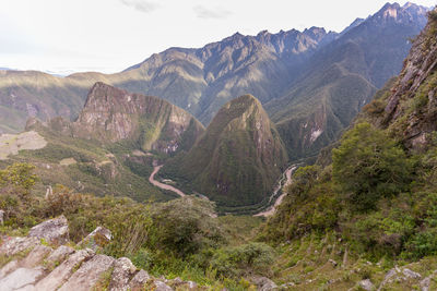 Scenic view of river amidst mountains