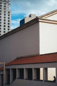 Low angle view of roof against sky in city