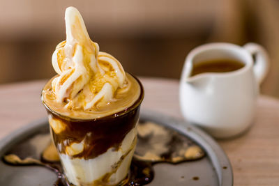 Close-up of ice cream in glass on table