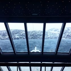 Scenic view of sea against sky seen through window