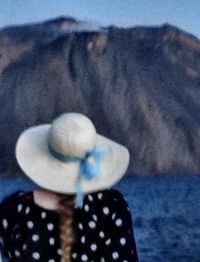 Rear view of woman wearing hat