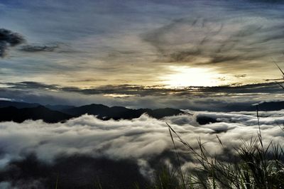 Scenic view of landscape against cloudy sky