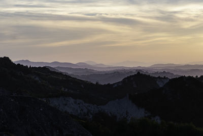 Scenic view of mountains against sky during sunset