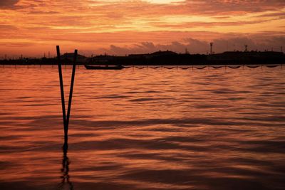 Scenic view of sea against romantic sky at sunset