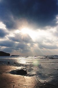 View of calm sea against cloudy sky