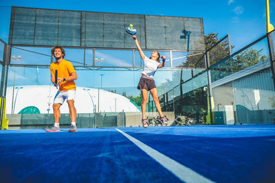 Low angle view of tennis players playing at court