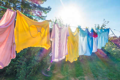 Low angle view of clothes drying against sky
