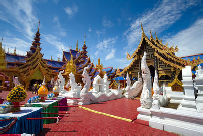 Statue of temple against building