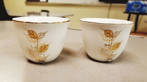 Close-up of coffee cup on table