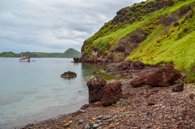 Scenic view of sea and rocks against sky