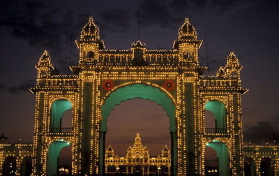 Illuminated entrance gate of mysore palace at night