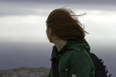 Woman standing against sky