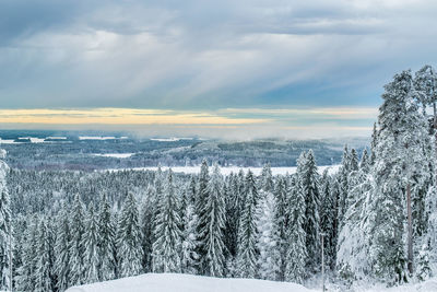 Scenic view of landscape against sky during winter