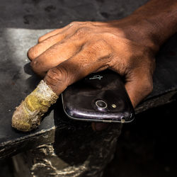 High angle view of man holding camera