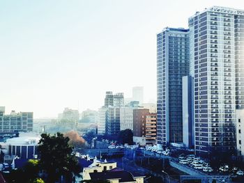 Modern buildings in city against sky