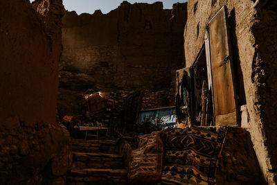 Old abandoned house amidst buildings