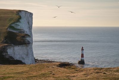 View of lighthouse on sea shore