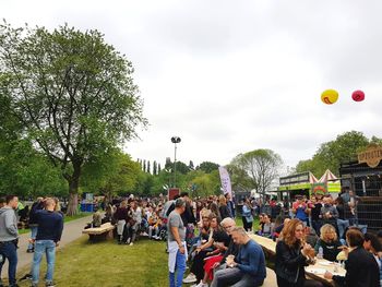 People at park against sky