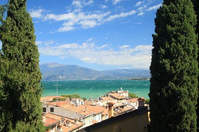 High angle view of townscape by sea