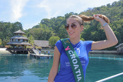 Portrait of smiling young woman in boat