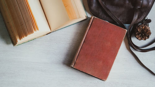 High angle view of open book on table at home