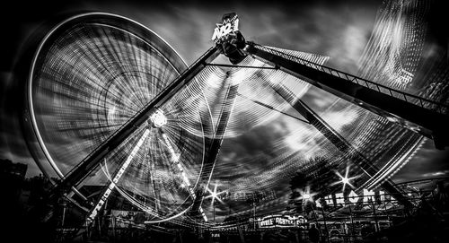 Low angle view of illuminated ferris wheel