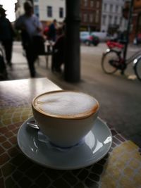 Coffee cup with coffee cup on table