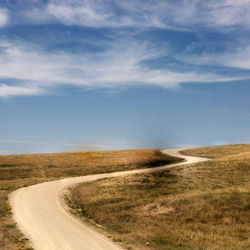 Road passing through field