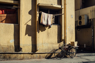 Bicycle hanging outside building