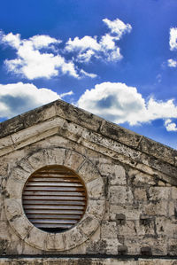 Low angle view of building against blue sky