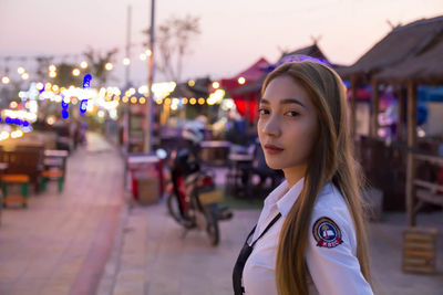 Portrait of sailor in city during sunset