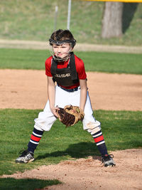 Rear view of boy on field