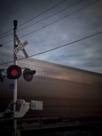 Low angle view of power lines against sky