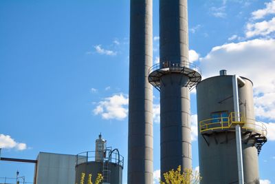 Low angle view of tower against blue sky