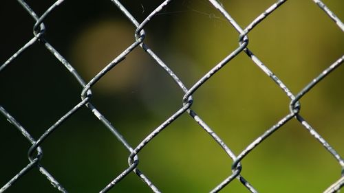 Full frame shot of chainlink fence against sky