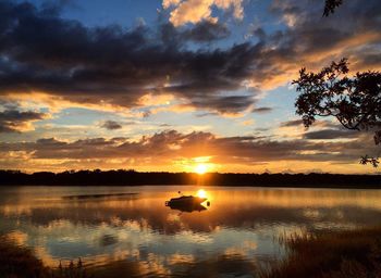 Scenic view of sunset over lake